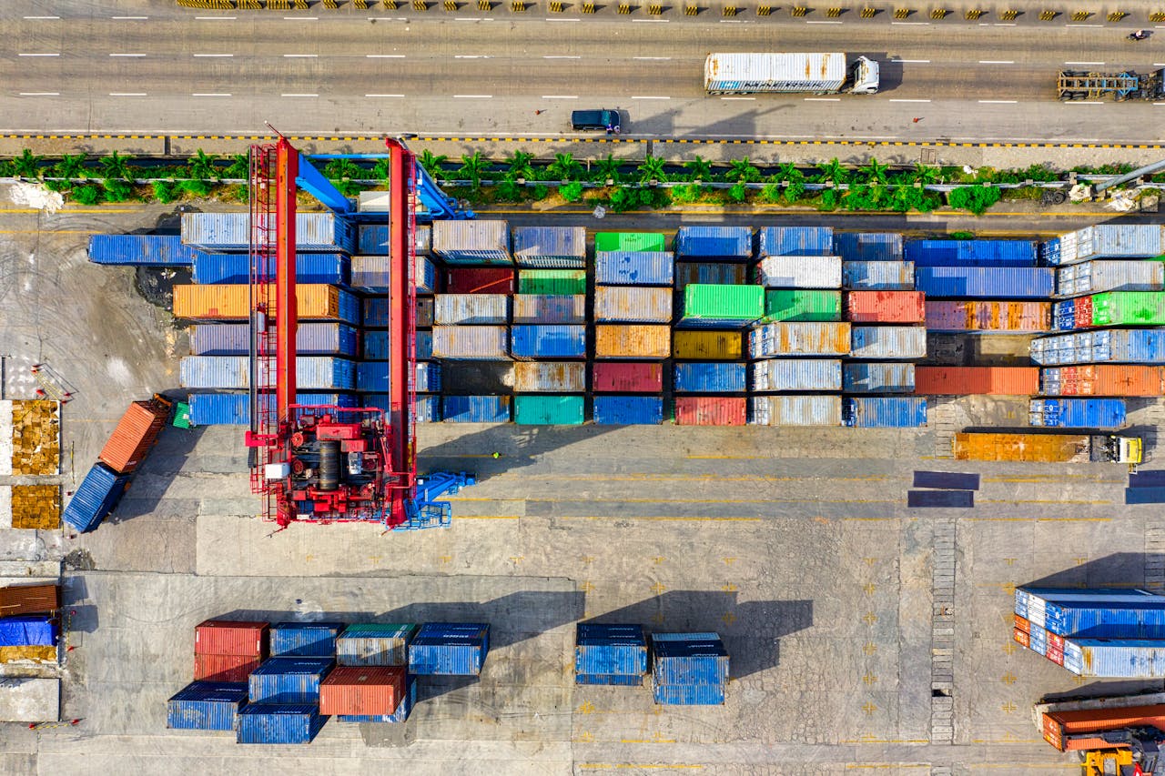 Colorful cargo containers organized at a shipping yard in North Jakarta, Indonesia.